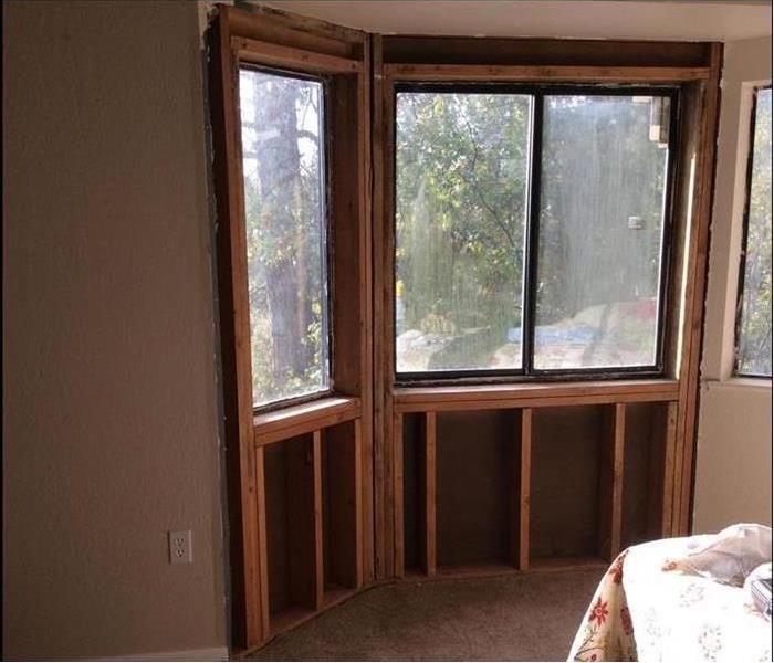Same bedroom window with drywall removed and materials dried