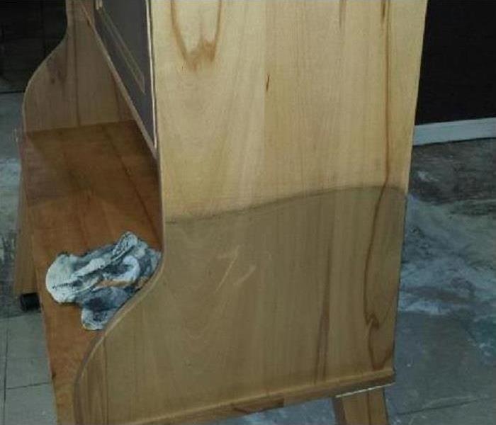 Piece of Furniture showing bottom half with soot damage