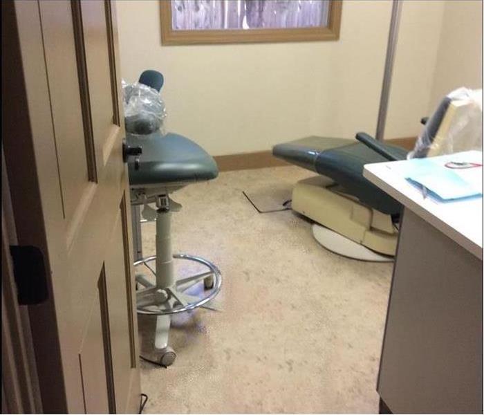 Dentist office room with water on the floor