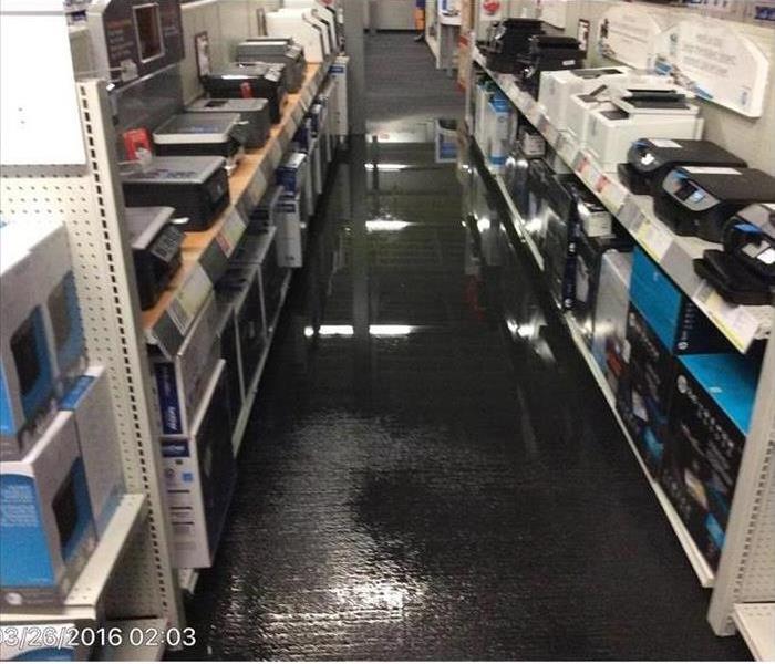 Office supply store's floor with water flooding