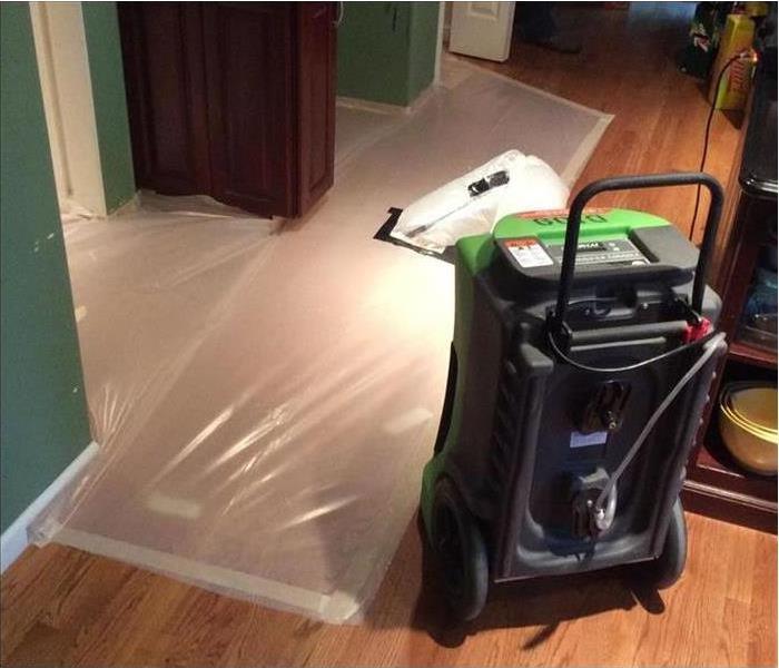 Flooring under plastic containment using specialty drying